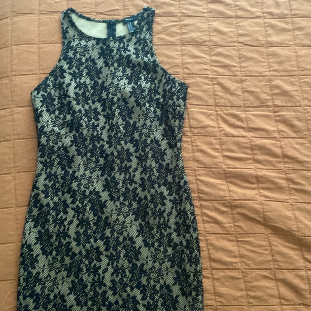 Forever mini dress tan color with black lace overlay. Medium size